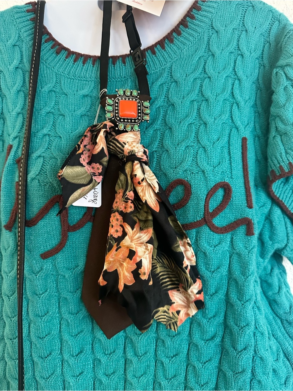 Brown tie necklace with silk scarf accents and turquoise and coral broche
